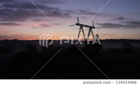 tower line, Grid countryside, Tower technology. Power lines stretched across landscape, linking together steel towers and pylons needed for electricity transmission. tower line, Grid countryside, Tower technology. Power lines stretched across landscape, linking together steel towers and pylons needed for electricity transmission. 134854986