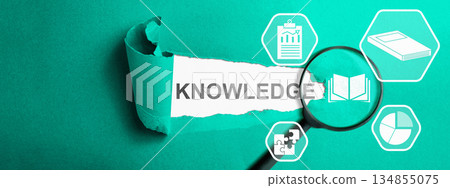 The word "knowledge" is revealed through torn paper, a magnifying glass focusing on a book icon, and surrounding icons related to data, puzzles, and books, symbolizing learning and discovery The word "knowledge" is revealed through torn paper, a magnifying glass focusing on a book icon, and surrounding icons related to data, puzzles, and books, symbolizing learning and discovery 134855075