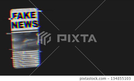 Mobile phone displaying the words "Fake News" with a glitch art effect. The image features a dark, distorted aesthetic. Concept of fake news 134855103