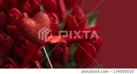 Red Tulip Bouquet with Glitter Heart on Red Background. Valentine's Day Celebration 134856016