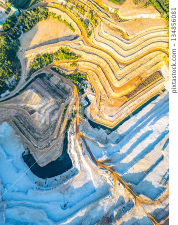 The sandstone quarry at Strelec in Czechia. The land has been shaped by quarrying activities. The colors of the land give a view of the terrain and natural resources. The sandstone quarry at Strelec in Czechia. The land has been shaped by quarrying activities. The colors of the land give a view of the terrain and natural resources. 134856081