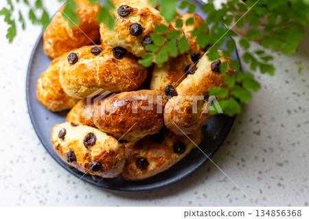 A plate of golden and crispy raisin scones A plate of golden and crispy raisin scones 134856368
