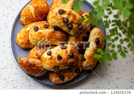A plate of golden and crispy raisin scones A plate of golden and crispy raisin scones 134856376