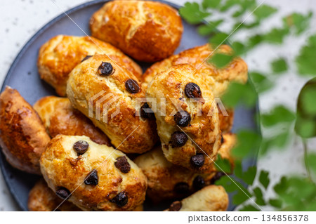 A plate of golden and crispy raisin scones A plate of golden and crispy raisin scones 134856378