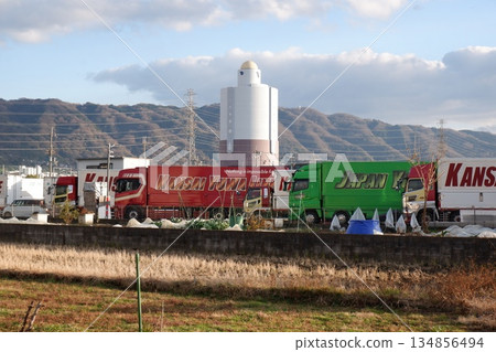 A transport truck parked dashing by 134856494