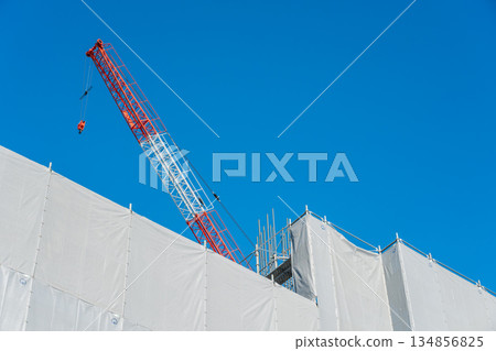 Blue sky and new condominium construction site Blue sky and new condominium construction site 134856825