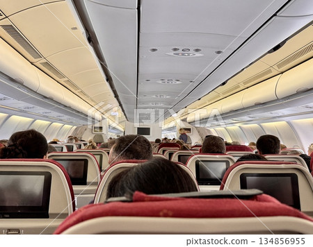 Passengers sitting on board the airbus 134856955