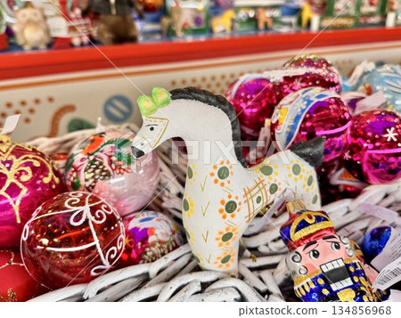 Bright Christmas Tree toys are hanging on the tree Bright Christmas Tree toys are hanging on the tree 134856968