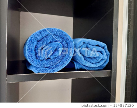 Clean towels of various sizes are rolled up Clean towels of various sizes are rolled up 134857120