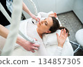Woman receiving a skincare treatment in a modern clinic 134857305