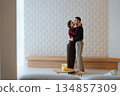 Couple dances together in a modern living room filled with intimacy 134857309