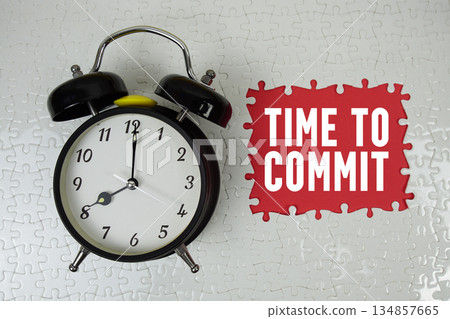 Time To Commit text with alarm clock on red background Time To Commit text with alarm clock on red background 134857665