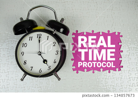 Real Time Protocol (RTP) text with alarm clock on pink background 134857673