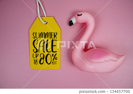 Price tag Sale 80% with pink flamingo summer decorations on pink background Price tag Sale 80% with pink flamingo summer decorations on pink background 134857700