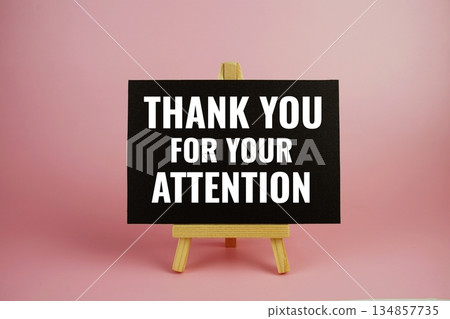 Thank you for your attention text written on paper card with wooden easel on pink background text written on paper card with wooden easel on pink background Thank you for your attention text written on paper card with wooden easel on pink background text written on paper card with wooden easel on pink background 134857735