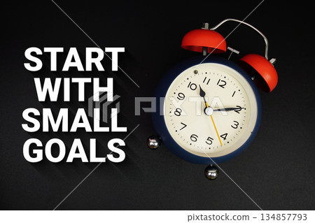 Start With Small Goals text with alarm clock on black background 134857793