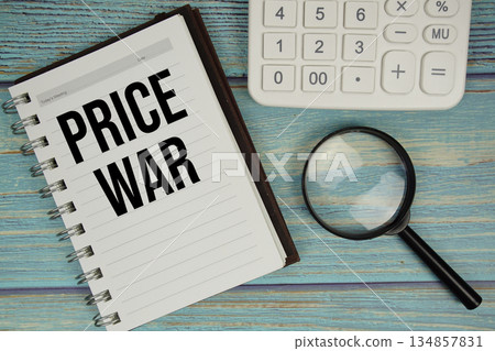 Price War text on notepad with magnifying glass and calculator on wooden background Price War text on notepad with magnifying glass and calculator on wooden background 134857831