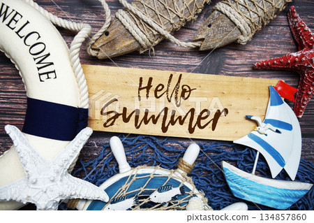 Hello Summer text message with marine decoration on wooden background 134857860
