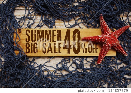 Summer Big Sale 40% off text on wooden sign decorated with Starfish and net on a wooden background Summer Big Sale 40% off text on wooden sign decorated with Starfish and net on a wooden background 134857879