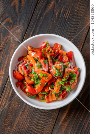 Mediterranean roasted red pepper medley with olive oil and fresh herbs 134858060