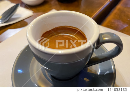 cup of espresso on plate on the table 134858183