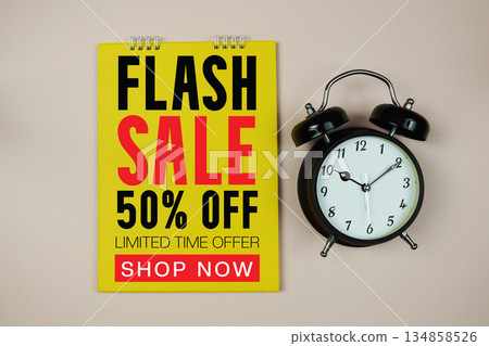 Flash Sale text with alarm clock on pink background 134858526