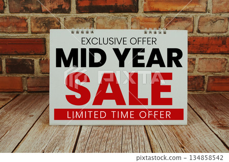 Mid Year Sale text Promotion and Marketing on wooden background 134858542