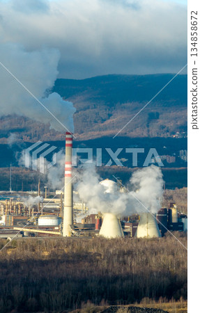 Aerial view of chemical plant. Smoking chimneys from factory. Chimneys of big factory polluting environment 134858672