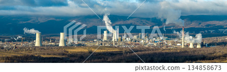 Aerial view of chemical plant. Smoking chimneys from factory. Chimneys of big factory polluting environment 134858673