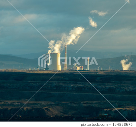 Aerial view of coal plant. Smoking chimneys from factory. Chimneys of big factory polluting environment Aerial view of coal plant. Smoking chimneys from factory. Chimneys of big factory polluting environment 134858675