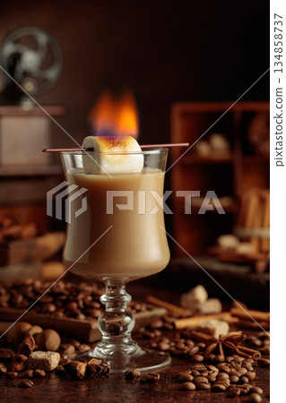 Cocktail of cream and coffee, decorated with a burning marshmallow. 134858737