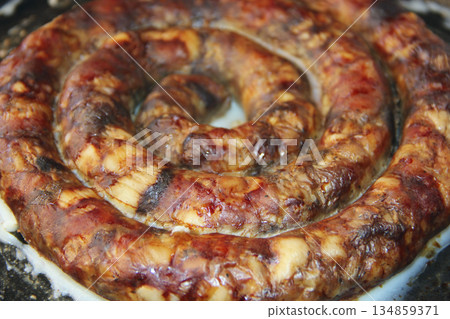 Sausage home-made from natural meat in rings 134859371