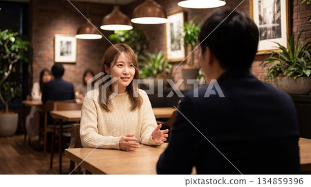 Couple having a conversation in a restaurant 134859396