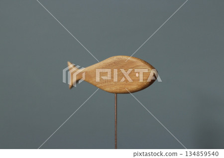wooden fish figurine close-up wooden fish figurine close-up 134859540