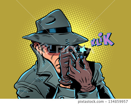 A male detective takes a photo. Surveillance of personal data and photographs. The state is spying on citizens. A male detective takes a photo. Surveillance of personal data and photographs. The state is spying on citizens. 134859957