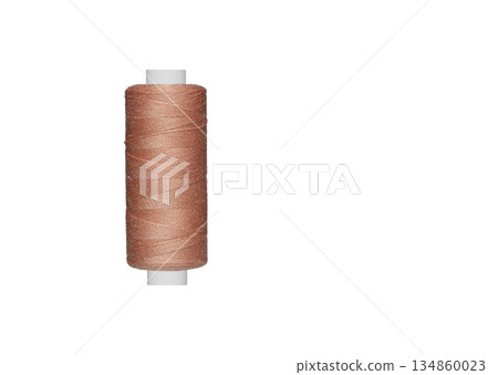 brown spool of sewing thread isolated on white background 134860023