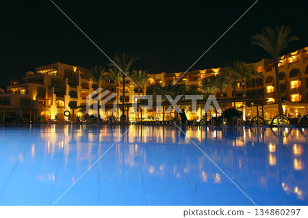 Five star hotel building with swimming pool in evening. luxurious hotel 134860297