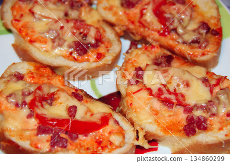 hot sandwiches with sausage and melted cheese hot sandwiches with sausage and melted cheese 134860299