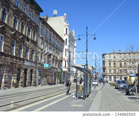 Views of the city of Lodz. Street of the Polish city Lodz during the day Views of the city of Lodz. Street of the Polish city Lodz during the day 134860505
