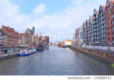 Beautiful architecture of buildings standing above water channel in Gdansk 134860511