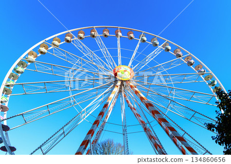 Urban Ferris wheel on sunny day Urban Ferris wheel on sunny day 134860656