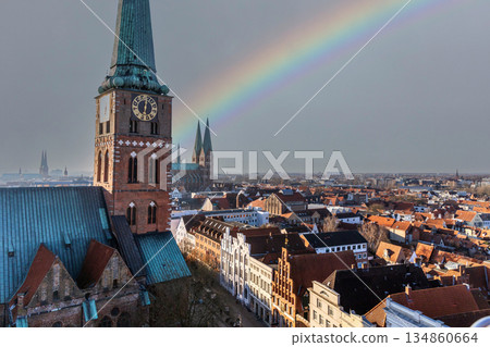 Rainbow over Lubeck Germany aerial view of historic city. Rainbow over Lubeck Germany aerial view of historic city. 134860664