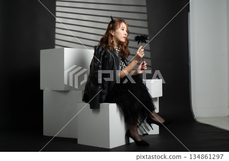 A woman in a black dress A woman in a black dress 134861297