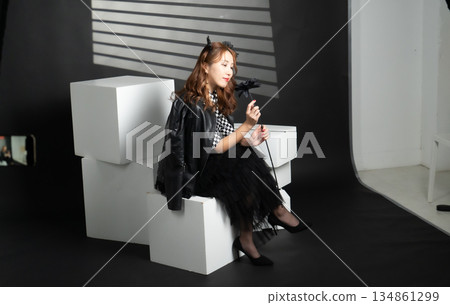 A woman in a black dress A woman in a black dress 134861299