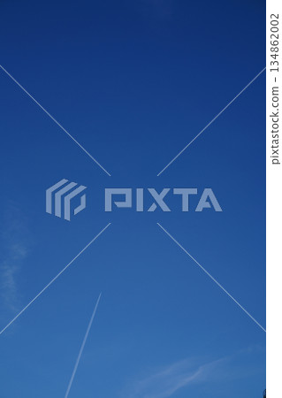 Contrails stretching across the blue sky of Kyoto Contrails stretching across the blue sky of Kyoto 134862002