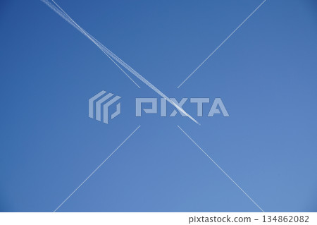 Contrails stretching across the blue sky of Kyoto Contrails stretching across the blue sky of Kyoto 134862082