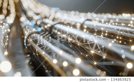 Close-up of blurred city street with flowing traffic lights and glowing bokeh effect at night 134863925