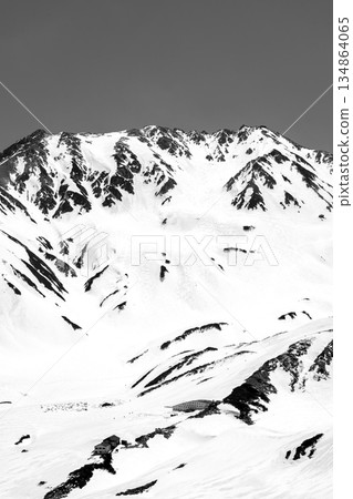 Mount Otani, the main mountain of the Tateyama mountain range, seen from the hiking trail of Mount Oku-Dainichi. Climbing Mount Oku-Dainichi in the Northern Alps during the snowy season. For newspaper advertisement. Mount Otani, the main mountain of the Tateyama mountain range, seen from the hiking trail of Mount Oku-Dainichi. Climbing Mount Oku-Dainichi in the Northern Alps during the snowy season. For newspaper advertisement. 134864065