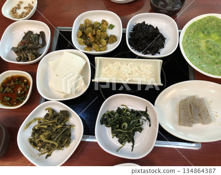 Traditional Korean Side Dishes Set Including Tofu, Seaweed, Namul, and More for Healthy Authentic Korean Cuisine Stock Photos 134864387