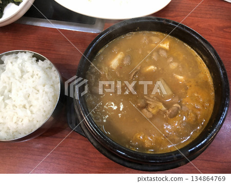 Authentic Korean Cheonggukjang Fermented Soybean Paste Soup with Tofu in Traditional Hot Stone Pot for Healthy and Nutritious Korean Cuisine 134864769